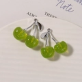 Detail of green cherry charms with gold glitter and silver leaf on a white ceramic plate - Silver Stem Glitter Green / 1 Piece