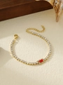 Detailed close-up of gold titanium bracelet with red gemstone pendant and zircon accents - Red Rectangular Style (ZHB697 Red)