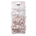 Detail of 4-piece set featuring white and pink floral cotton bow hair clips on card - White & Pink Floral
