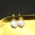 Elegant gold baroque pearl earrings with emerald green gemstones on a vintage tray - White Medium-14mm-Green Zirconia