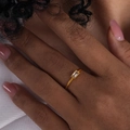 Gold-finish minimalist ring featuring a rectangular clear zircon stone on a model's hand - Gold White Zirconia (A495)