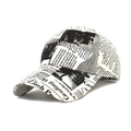 Detail of vintage newspaper print baseball cap with black text on cream fabric - White