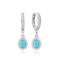 Macro shot of silver drop earrings with oval sky blue gemstones and zircon halo detail - Oval Sky Blue Zirconia