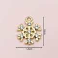 Detailed view of a golden snowflake charm with white rhinestones measuring 1.8cm by 1.5cm - 2397 Rhinestone Snowflake