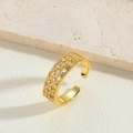 Elegant gold plated star ring with sparkling zircon inlays on textured stone - White Zirconia Style