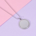 Polished stainless steel round pendant necklace with rope edge detail on pink background - Steel Color (MP097)