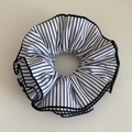 Close-up of oversized fabric scrunchie with black and white vertical stripes and stitching - Black & White Stripes