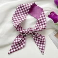 Purple and white checkerboard narrow silk scarf tied in a bow on a white fabric background - Deep Rose Checkerboard