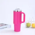 Macro detail of the pink stainless steel 40oz insulated tumbler with handle and straw hole - Rose Red (Generation 2)