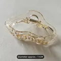 Detail of 11cm transparent champagne wavy hair claw clip with golden metal spring - Clear