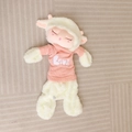 Close-up of sheep plush toy in pink knitted sweater with LOVE lettering detail - White Sleeping Sheep Doll Shell