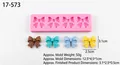 Moule en silicone rose pour nœuds avec 4 cavités et échantillons finis de couleurs - Modèle 3 / Rose