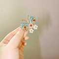 Vintage butterfly hair clip with blue enamel, white flowers and pearls in gold finish - F1149 Butterfly Left