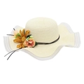Detail of sunflower and floral decoration on a cream woven straw sun hat with wavy brim - One Size / Cream