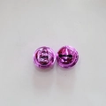 Macro detail of glossy purple metal bells with vacuum plating and top hanging holes - Purple