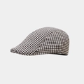 Detail van de dikke wollen pied-de-poule stof en de rand van deze vintage baret muts - Donkerbruin