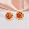 Detail of vintage round 18K gold earrings with brown faux stone and hammered texture - Reddish Brown Marble
