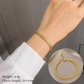 Titanium steel V-shaped gold chain bracelet on model wrist with arrow pattern detail - V-Shape Arrowhead Pattern (T124) / Gold (T124)