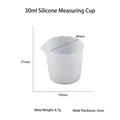 Translucent 30ml silicone measuring cup with V-shaped spout and clear markings - 30ml Silicone Measuring Cup