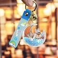 Portachiavi con coniglio luna e sabbie mobili blu con cinturino wish e campanellino - Blu