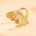 Adjustable golden stainless steel ring featuring a detailed ginkgo leaf design on peach background - J03484 / Gold