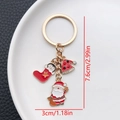 Christmas keychain with red santa hat and stocking charms on white ceramic plate - ER822-Enamel Santa Penguin Sock Sleeping Cap Keychain