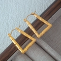 Elegant gold stainless steel bamboo hoop earrings with square textured nature-inspired design - Gold
