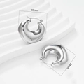 Macro view of silver chunky C-shaped hoop earrings showing 30mm diameter measurements - Silver Earrings