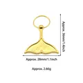 Detailed view of gold mermaid tail pendant with 36mm height and 28mm width dimensions - Dolphin Tail