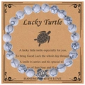 8mm white turquoise stone bead bracelet with antique silver turtle charm on display card - Howlite