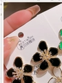 Elegant five-petal flower stud earrings with enamel finish and crystal center detail - Black Petal Gold Border / Black