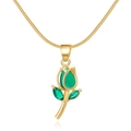 Macro detail of elegant gold tulip pendant with green crystals on fine snake chain - Necklace-Green