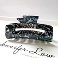 Close-up of a 8.3cm marble texture acetate hair claw clip with hollow rectangular design - 14# Black White Grey Marble