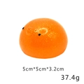 Detailed view of orange glitter squeeze toy measuring 5cm x 5cm and weighing 37.4g - Large Glitter Round Chicken 37.4g