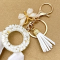 Fashion gold butterfly and white resin ring keychain with faux leather tassel for handbags - Letter O