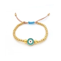 Detailed view of adjustable evil eye bead bracelet with gold accents and woven cord - Blue Pendant Necklace