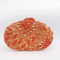 Luxuriöse orangefarbene Blumen-Clutch mit Blattmuster und goldenem Metallrahmen - Orangerot