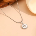 Macro shot of silver stainless steel heart pendant necklace on silk fabric and wood background - Steel Color Heart Necklace (H714)