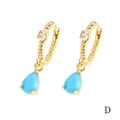 Macro detail of 18K gold hoop earrings with blue pear-cut stone and square zircon - Light Blue Teardrop (ER1138)