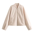 Dettaglio ravvicinato della giacca bomber rosa cipria con cerniera e pile morbido - Taglia S / Beige