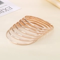Stackable rose gold 3.6mm stainless steel bangles with polished round finish - Inner Diameter 55mm / 7 Rings / Rose Gold