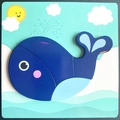 Cartoon whale wooden peg puzzle for toddlers featuring blue pieces and ocean background - New Jm 3d - Blue Whale