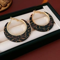 Macro shot of large leopard print hoop earrings in a black jewelry box for women - 20# Gold Black Texture Resin Hoop Earrings with Silver Pin