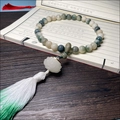 Zen style bodhi root bead bracelet with lotus pendant and green silk tassel decoration - Hand-held Floating Flower (Luminous Lotus)