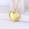 Polished golden heart locket necklace with delicate chain on white marble - Smooth Heart 29*29/Gold