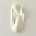 Creamy beige cotton low-cut ankle sock featuring a green hello embroidery detail - One Size / Cream
