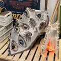 Close-up of Bohemian woven camping blanket featuring colorful eye patterns and fringe details - XT07-2 Colorful Eyes