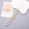 Detailed view of handmade beaded phone strap with cream pearls and pink heart charms - K054 Pink Heart
