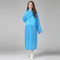 Reusable blue translucent hooded raincoat for women with snap buttons and waterproof finish - Blue