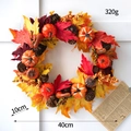 Autumn Halloween wreath with pumpkins, maple leaves, and pine cones on a white background - Halloween Wreath Style J